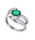 White gold ring with a Emerald and Diamonds