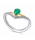 White gold ring with an Emerald and a Diamond